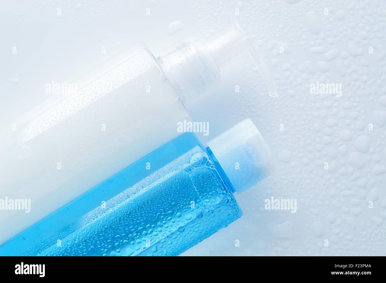Daily cleansing cosmetics - face wash cleansing gel, smoothing toner with water drops on white background. Copy space. Stock Photo