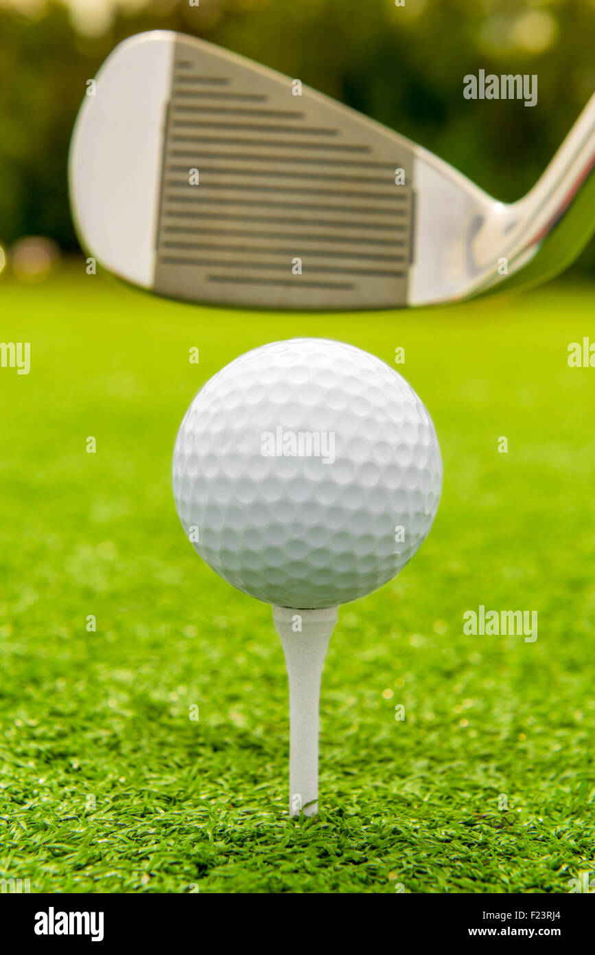 Vertical shot the putter and golf ball on a lawn Stock Photo - Alamy