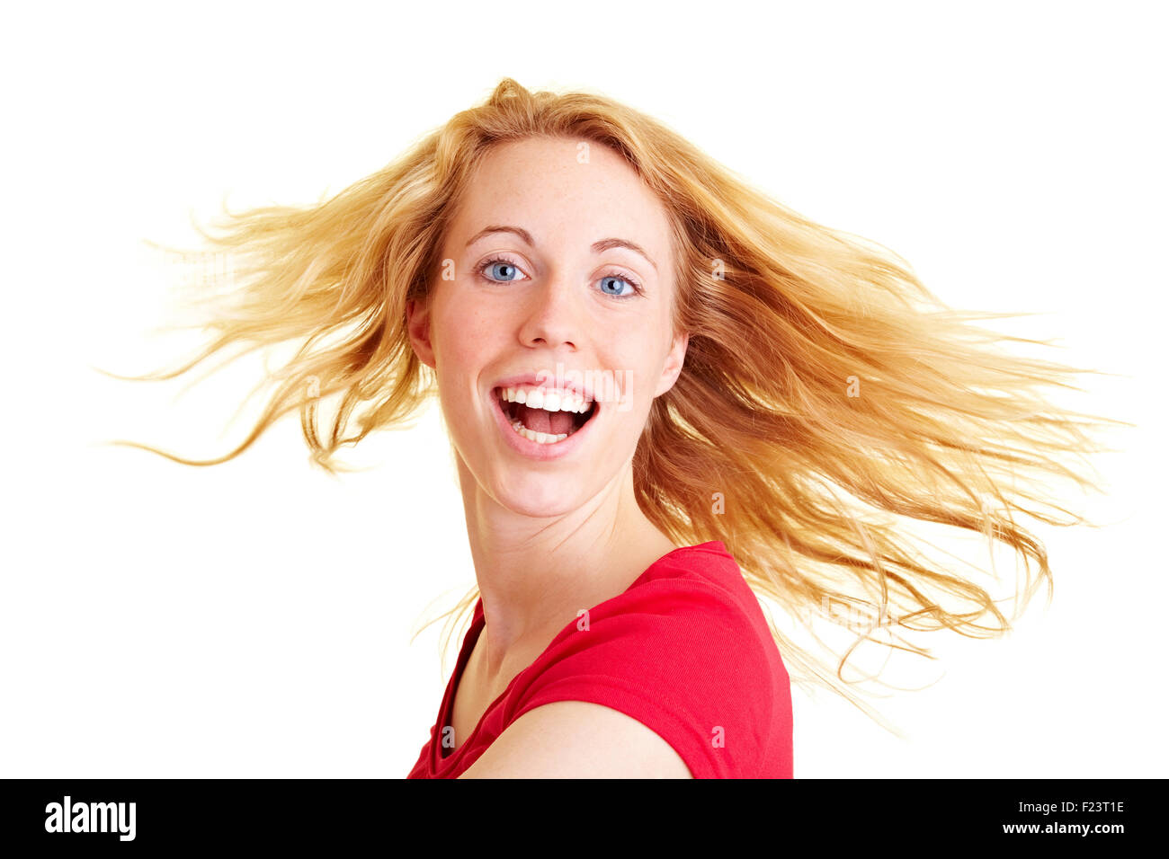 Happy woman with long hair dancing and smiling Stock Photo - Alamy