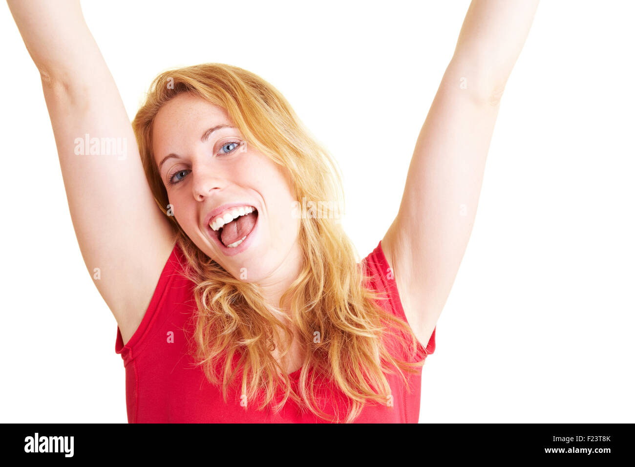 Happy woman smiling and cheering with her arms stretched Stock Photo