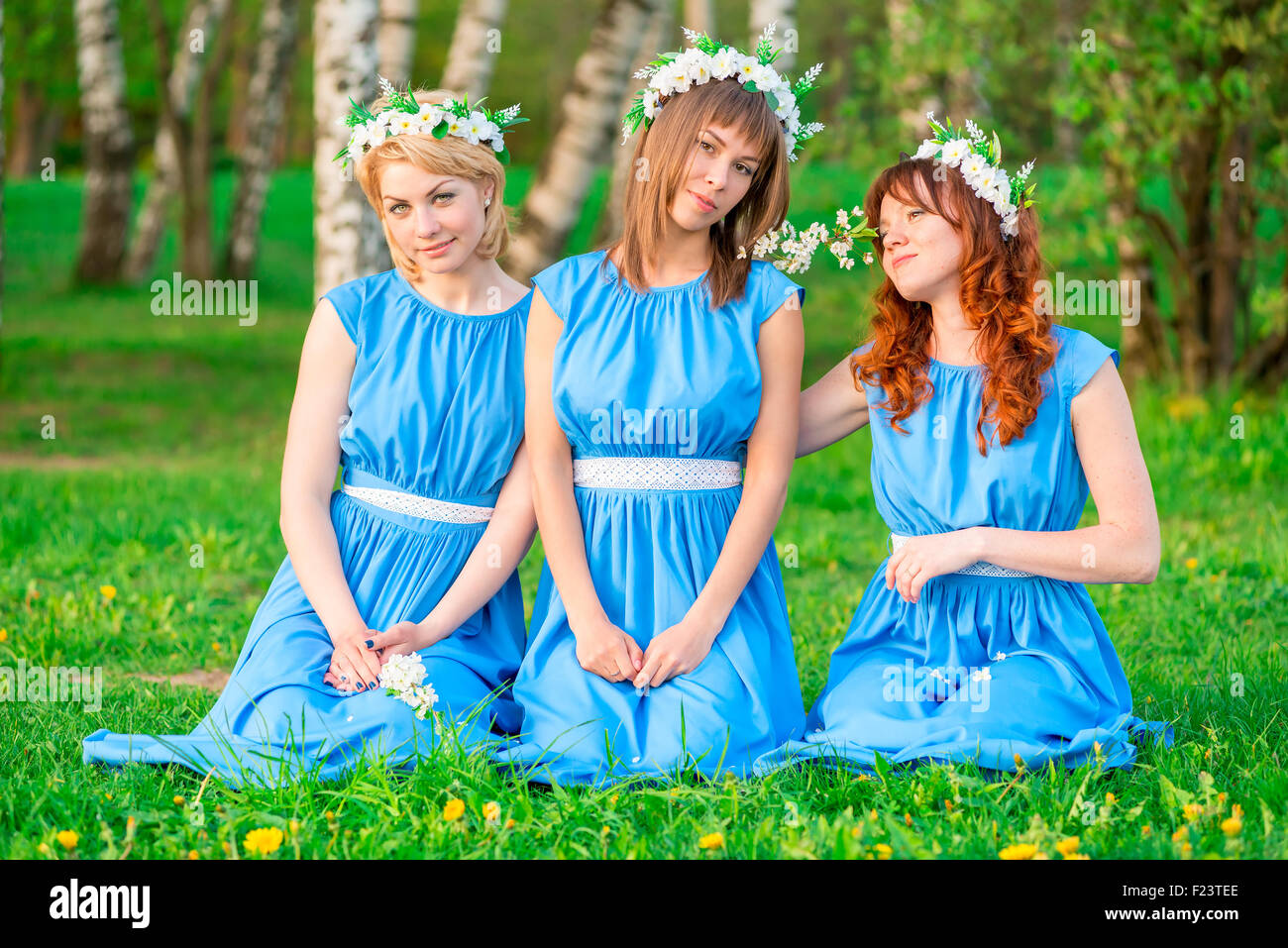 beautiful girls on the green grass in the park Stock Photo - Alamy