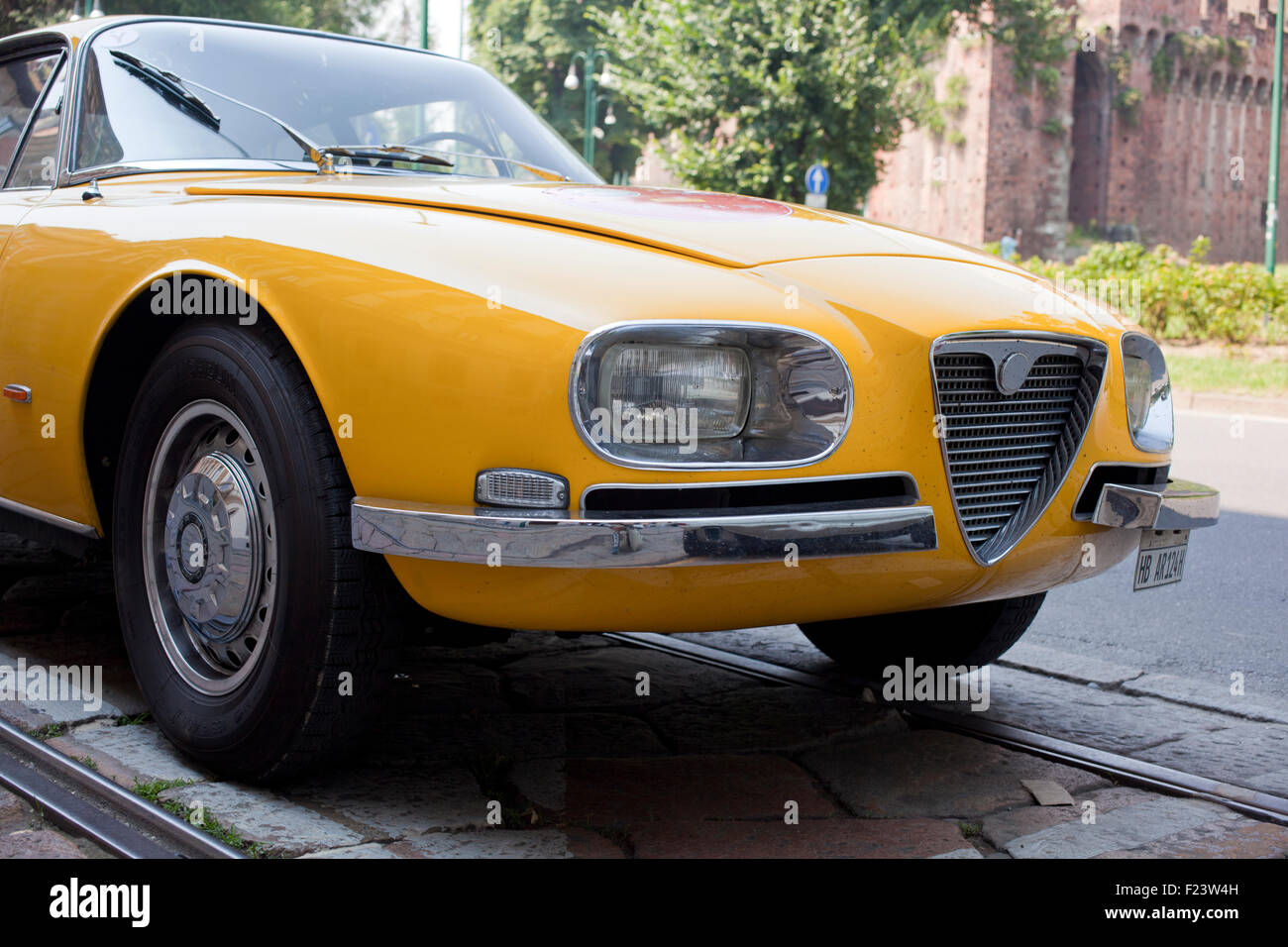 Yellow vintage car in the street Stock Photo Alamy