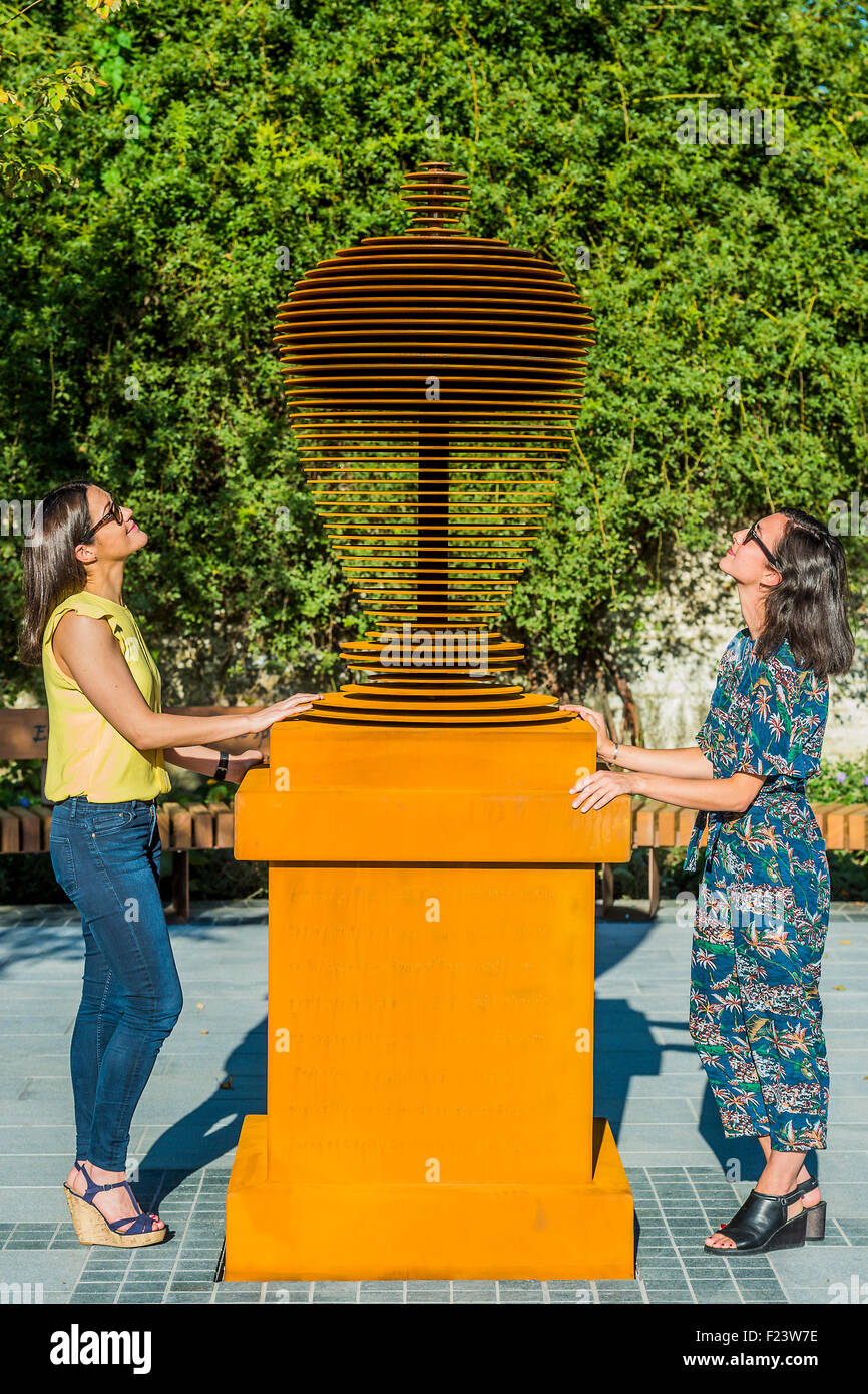 Twickenham, London, UK. 10th September, 2015. Visitors enjoy the indian summer in the new garden - The new Pope’s Urn is based on a long-lost original and has been designed by award-winning architects Feilden Clegg Bradley Studios to celebrate Alexander Pope (1688-1744) one of England’s greatest poets, and Twickenham’s most famous resident. Standing just over eight-foot high, this stylish contemporary sculpture mirrors the shape of the original urn, and is a reminder of the poet’s great contributions to garden and landscape design. Credit:  Guy Bell/Alamy Live News Stock Photo