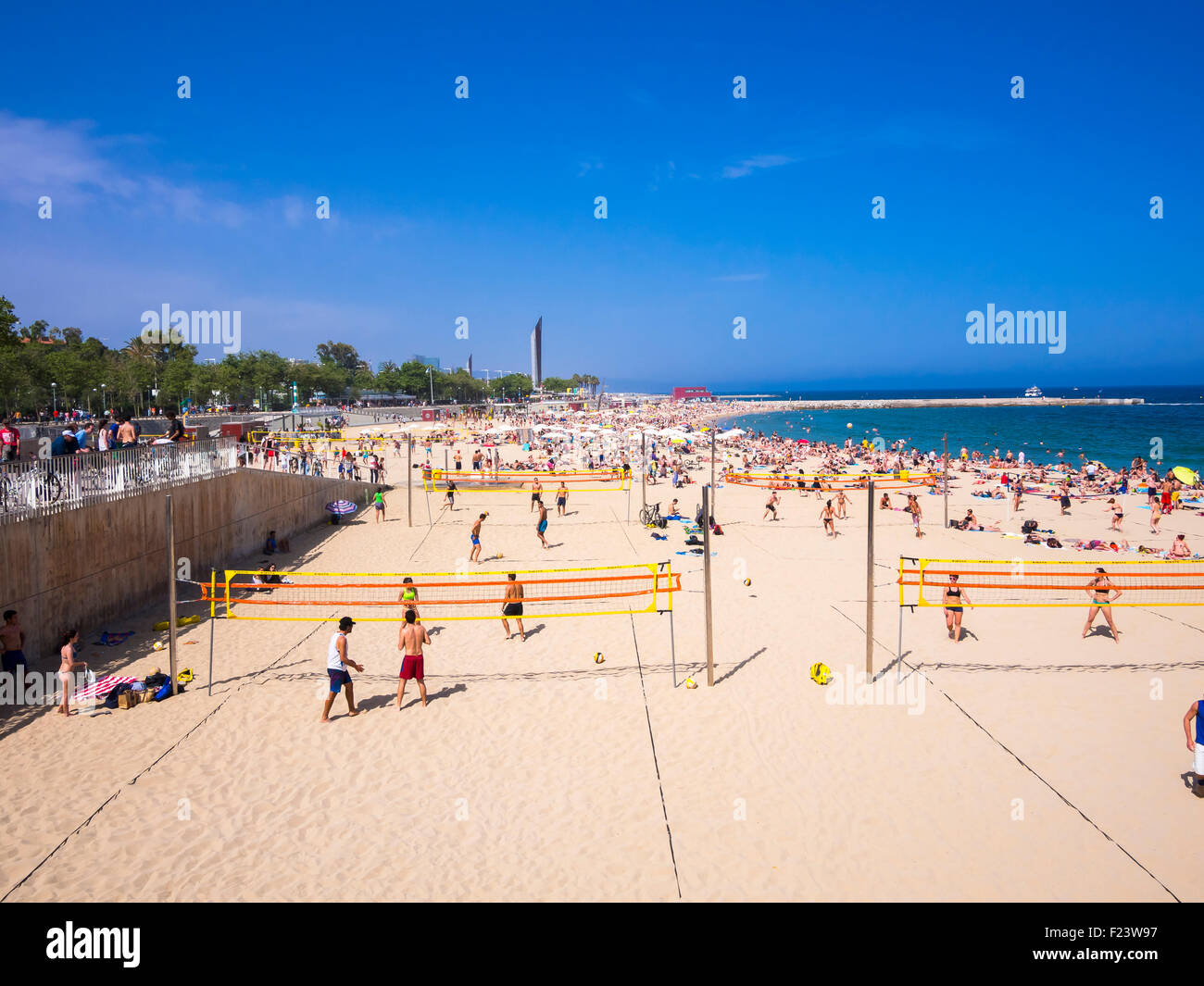 People on the crowded beach, volleyball, Port Olimpic, Barcelona