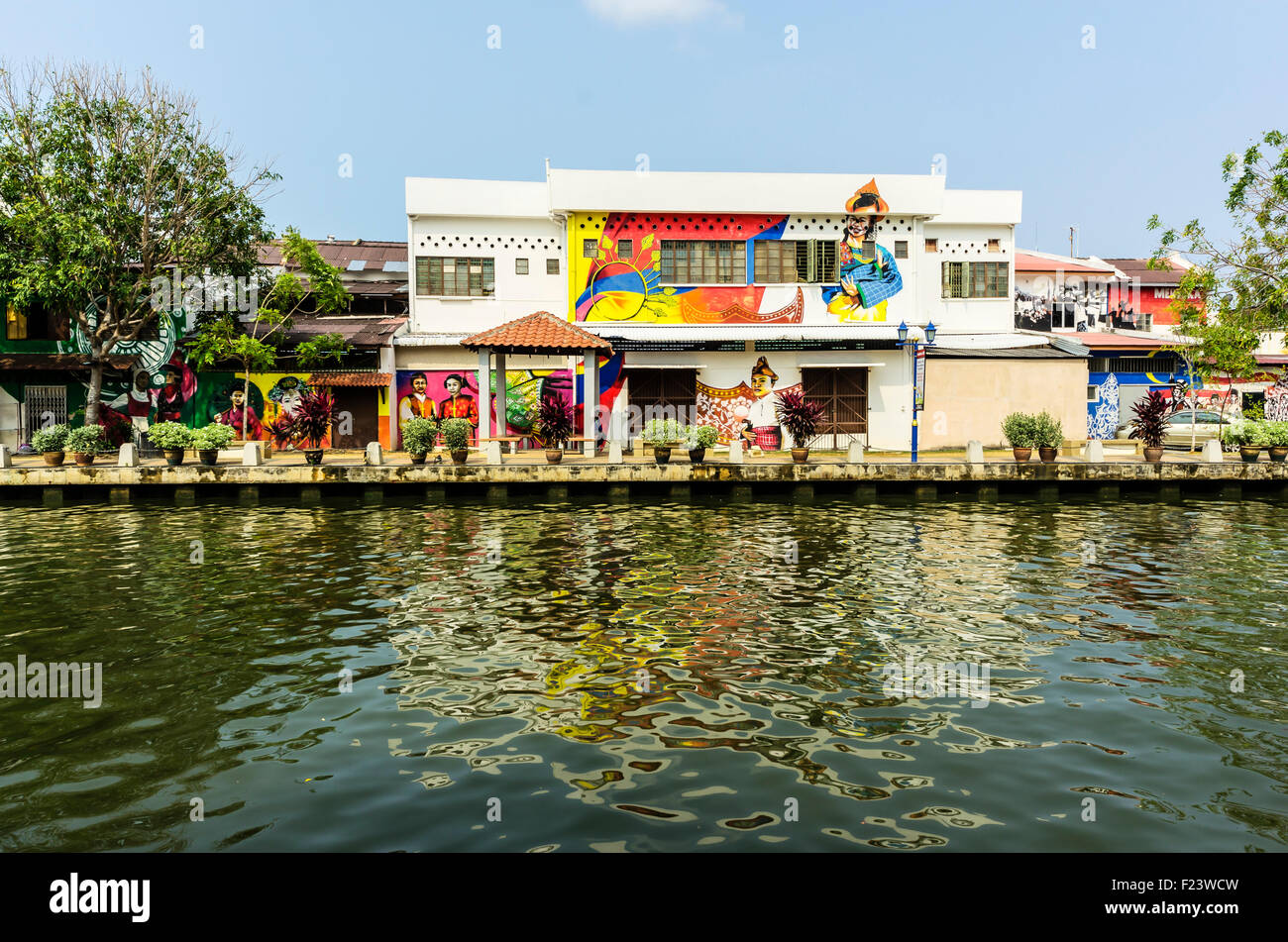 Brightly painted house fronts along the Malacca River, district of Kampung Bakar Batu, Malacca or Melaka, Malaysia Stock Photo