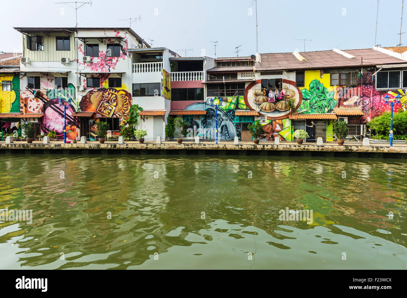 Brightly painted house fronts along the Malacca River, district of Kampung Bakar Batu, Malacca or Melaka, Malaysia Stock Photo