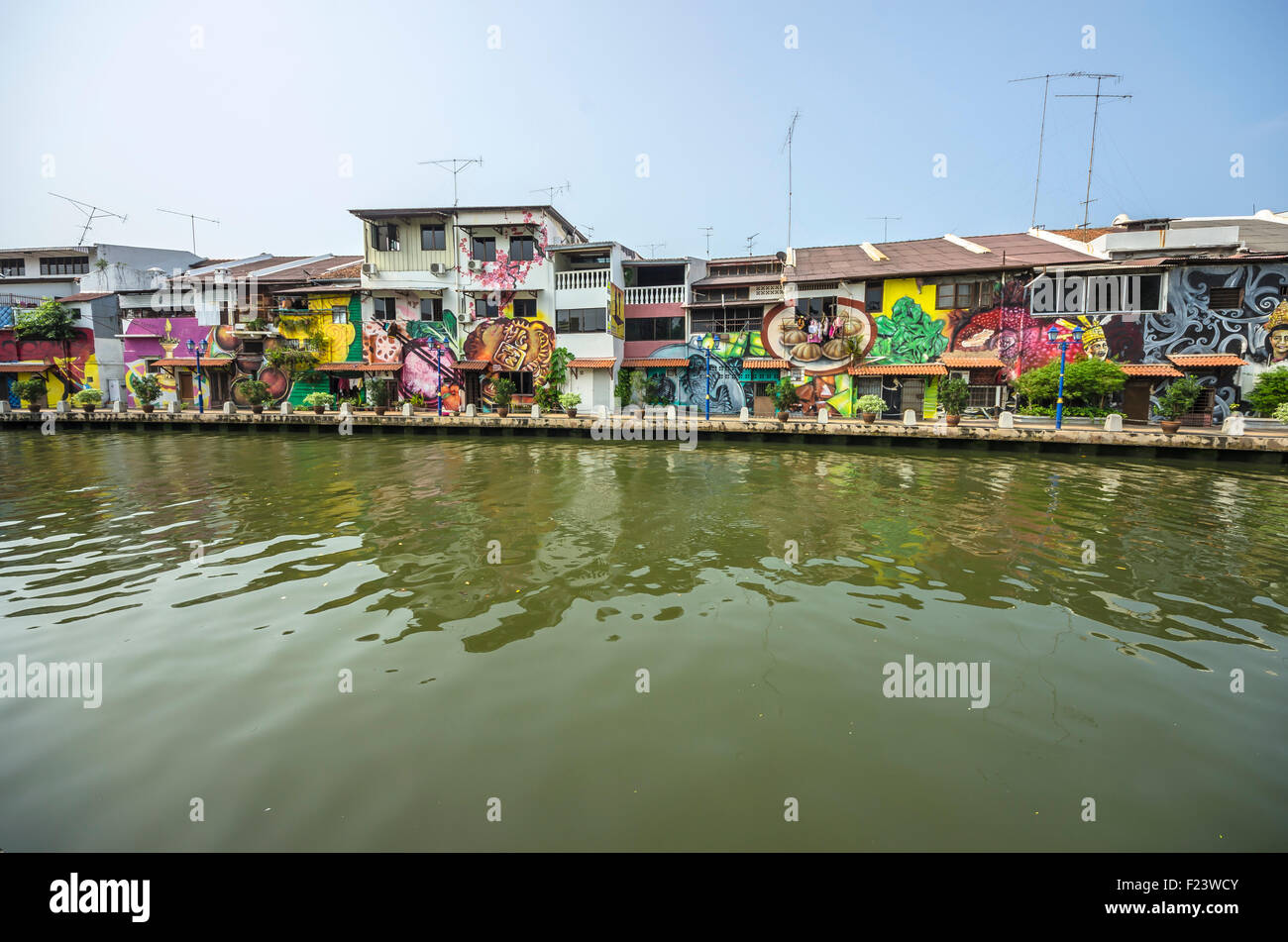 Brightly painted house fronts along the Malacca River, district of Kampung Bakar Batu, Malacca or Melaka, Malaysia Stock Photo