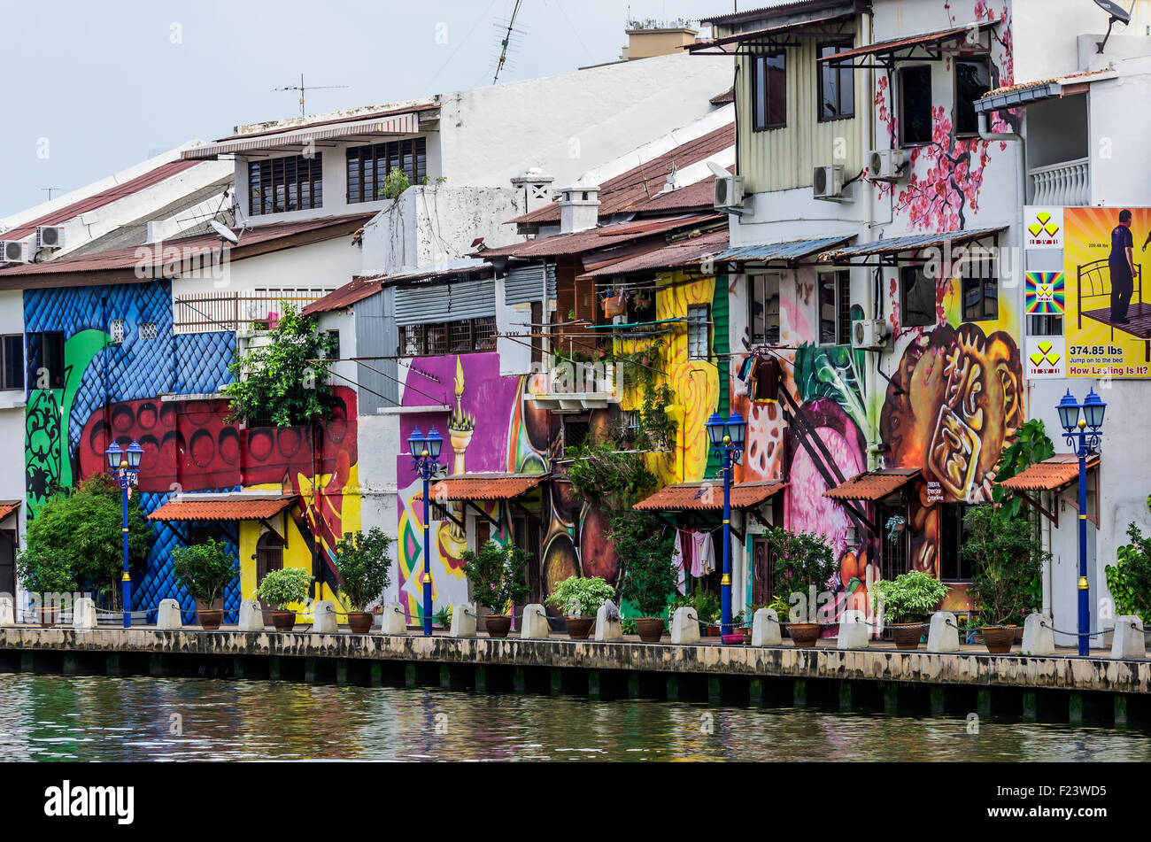 Brightly painted house fronts along the Malacca River, district of Kampung Bakar Batu, Malacca or Melaka, Malaysia Stock Photo