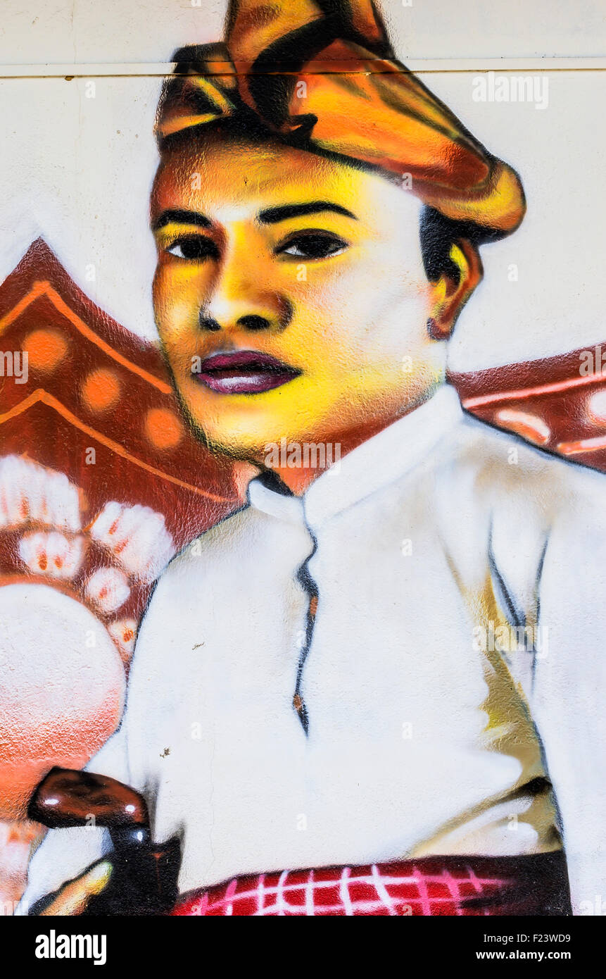 Painted image of a traditionally dressed man on a house wall, district Kampung Bakar Batu, Malacca or Melaka, Malaysia Stock Photo