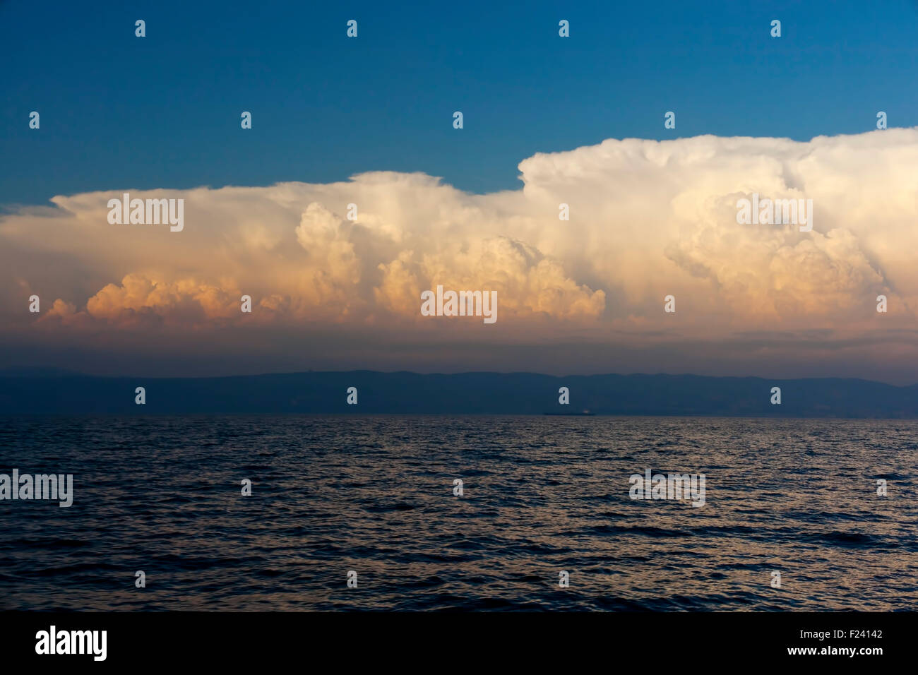 Cloudy sky on the sea at sunset Stock Photo - Alamy