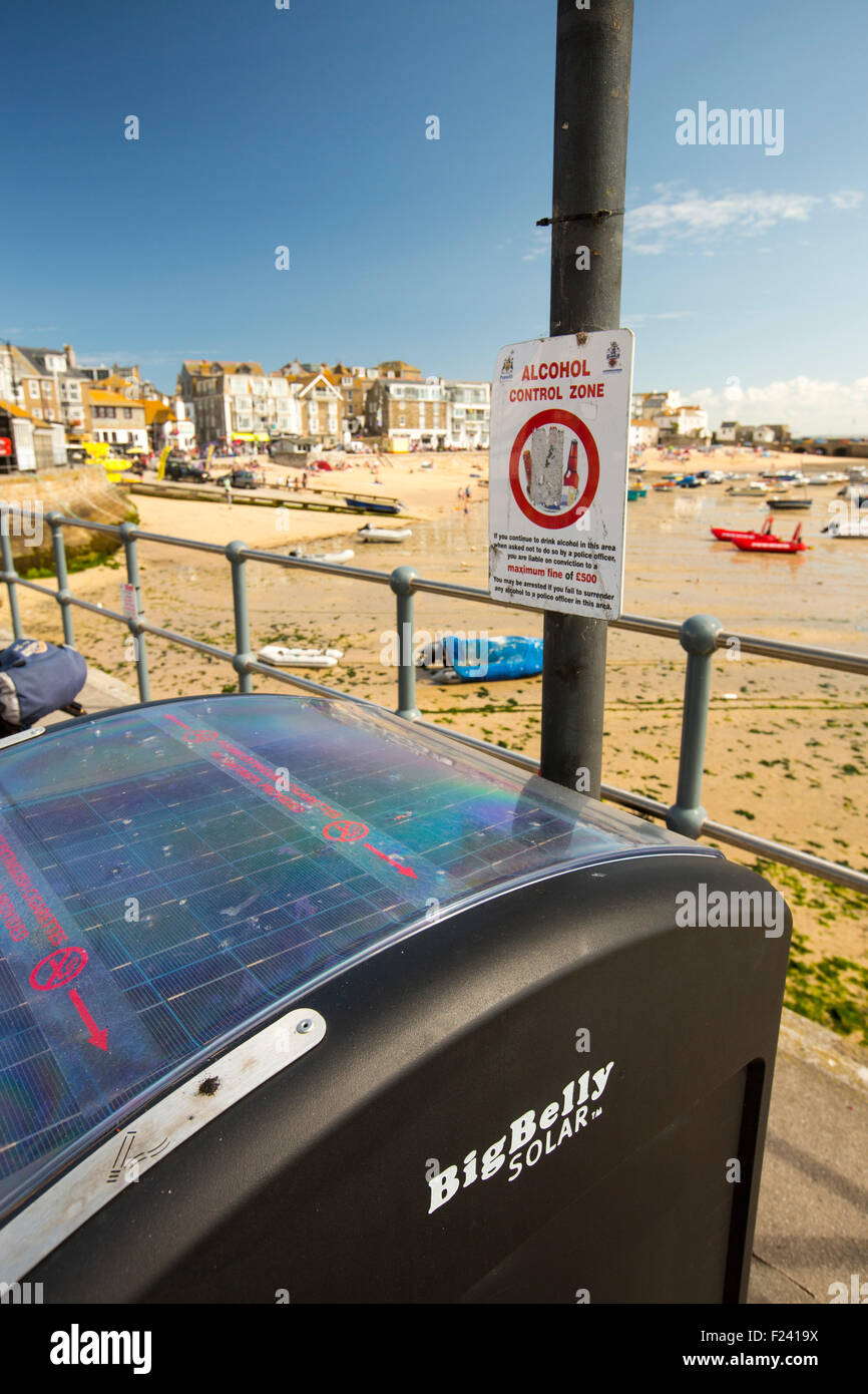 A big Belly solar litter bin on the promenade in St Ives, Cornwall, UK. The solar powered bin, compacts the rubbish so it needs Stock Photo