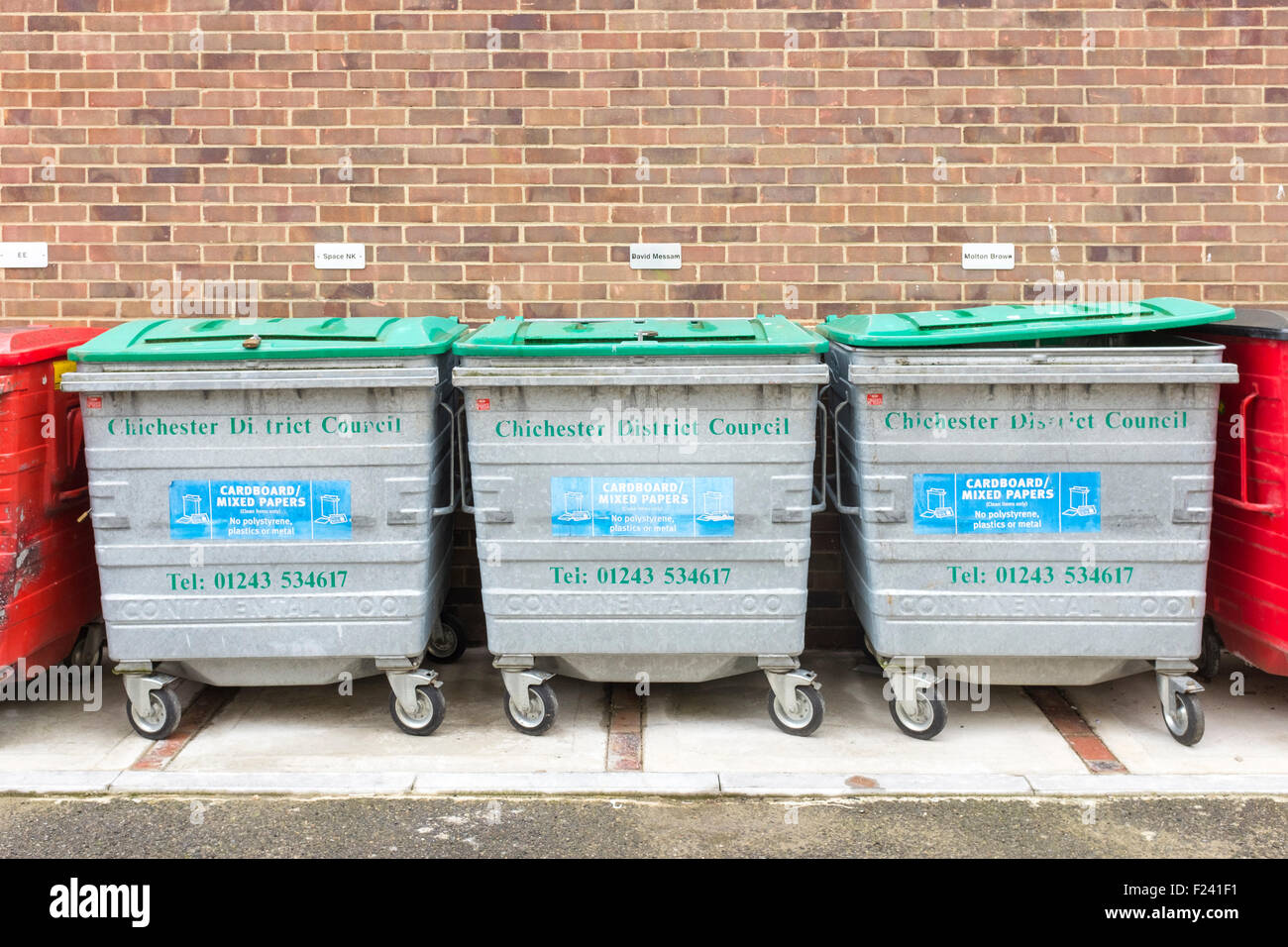 Row of grey metal refuse and recycling bins for cardboard and mixed papers, Chichester. Stock Photo