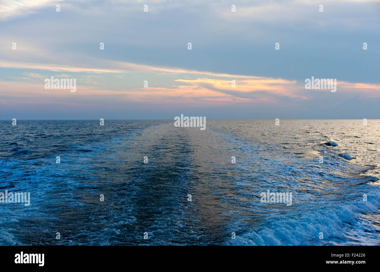 Wave on the sea at sunset Stock Photo - Alamy