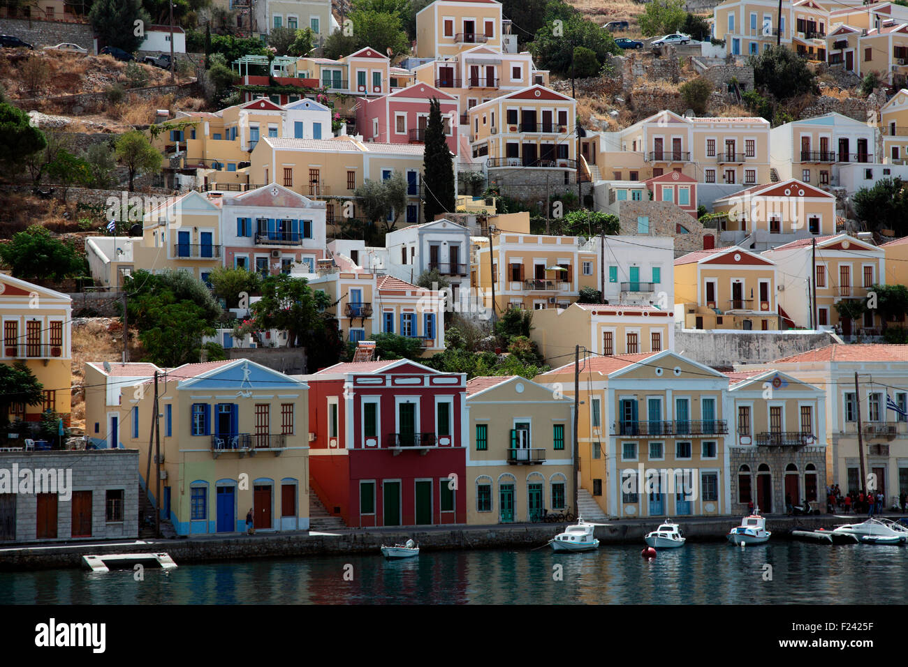 Symi neoclassical houses rising up from the waterfront. Stock Photo