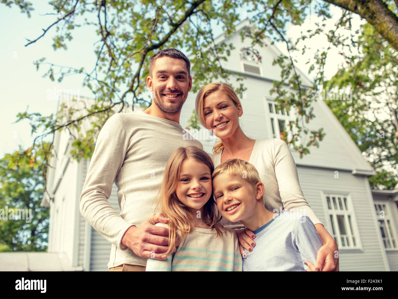 happy family in front of house outdoors Stock Photo - Alamy