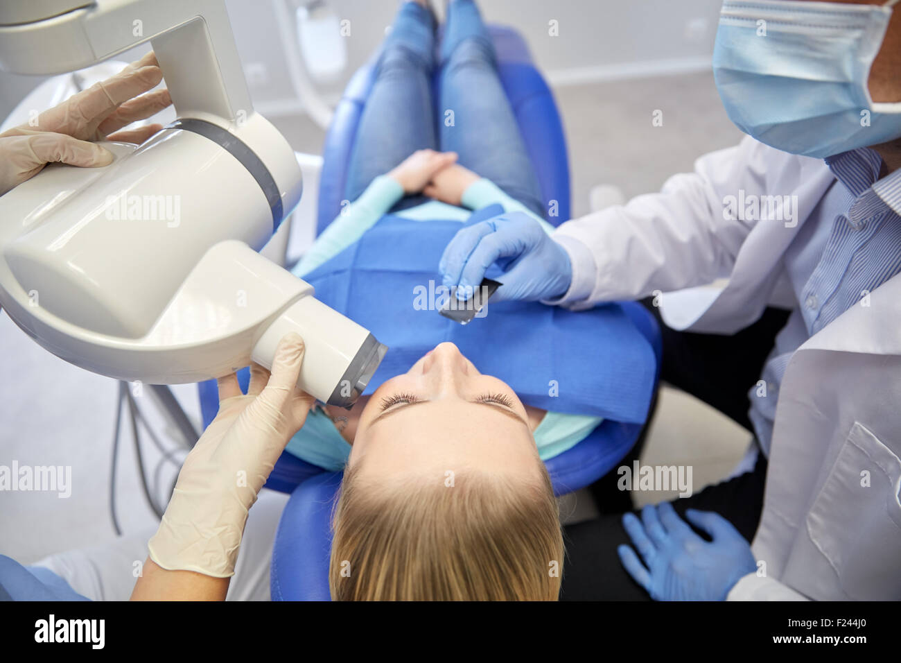 dentist and patient with dental xray machine Stock Photo Alamy