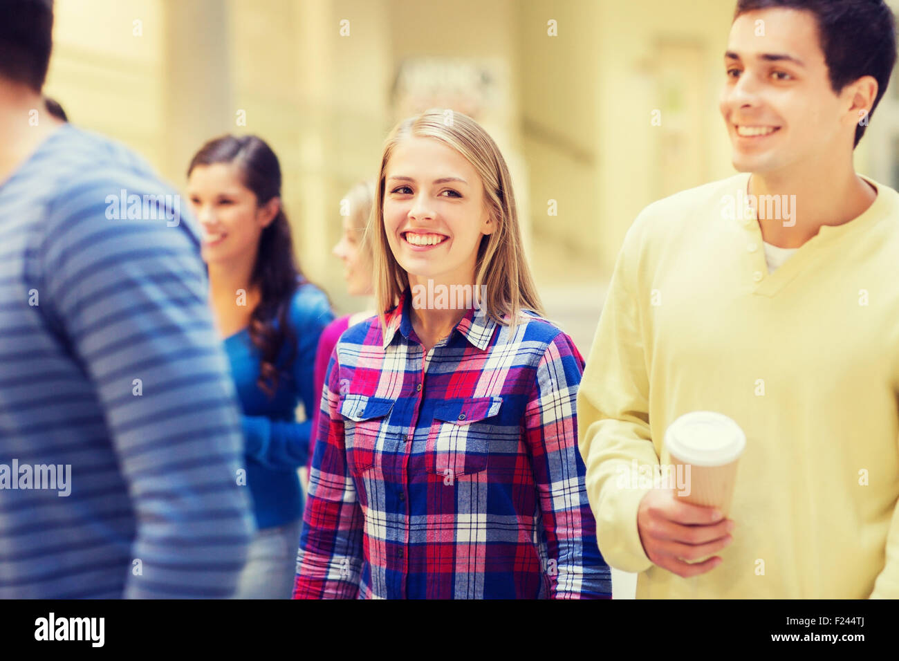 group of smiling students with paper coffee cups Stock Photo - Alamy