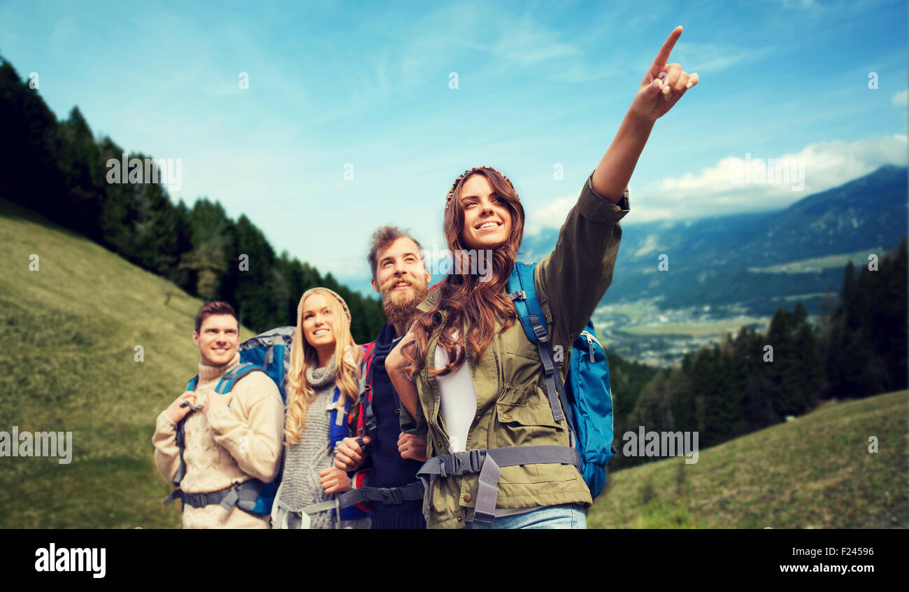 group of smiling friends with backpacks hiking Stock Photo - Alamy