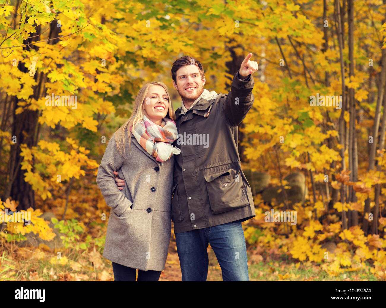 smiling couple hugging in autumn park Stock Photo - Alamy