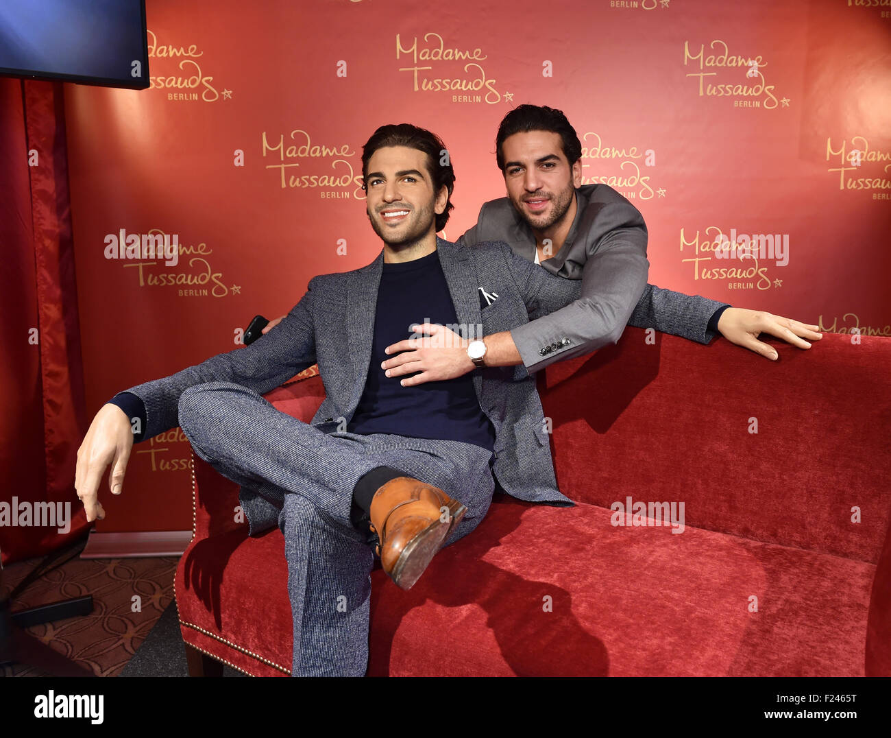 Austrian actor Elyas M’Barek (R) poses with his wax figure at Madame