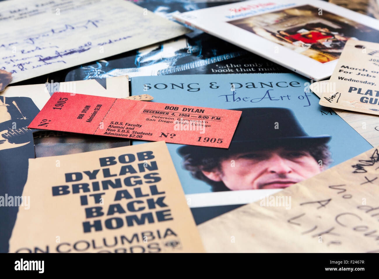 Bob Dylan memorabilia. Scattered display of tickets, books, CD and CD