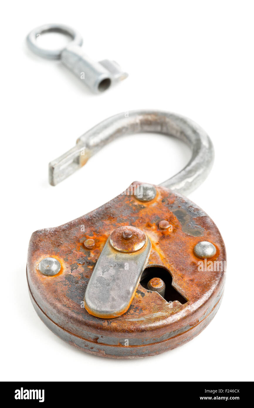 Old rusty padlock with open latch and key on white background Stock ...