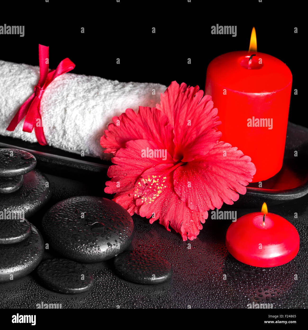 beautiful spa background of hibiscus flower with dew, red candles and white rolled towel tied with ribbon on zen stones, closeup Stock Photo - Alamy beautiful spa background of hibiscus flower with dew, red candles and white rolled towel tied with ribbon on zen stones, closeup Stock Photo - Alamy