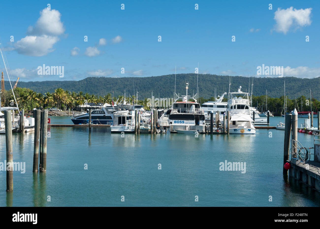 The Dickson Inlet of Port Douglas in tropical Queensland is home to a marina and small port Stock Photo