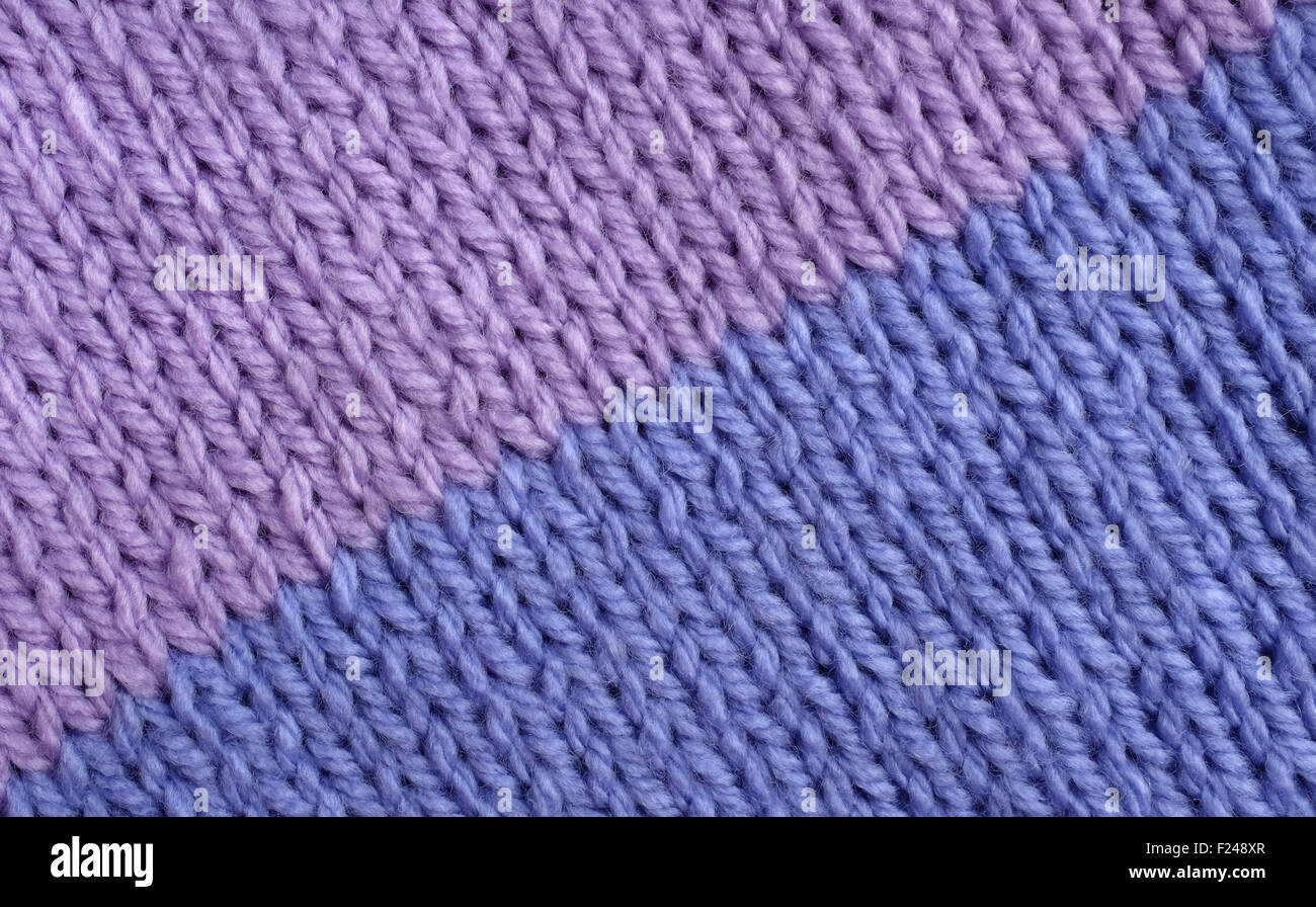 Two colour stocking stitch knitting in lilac and blue as an abstract background texture Stock Photo