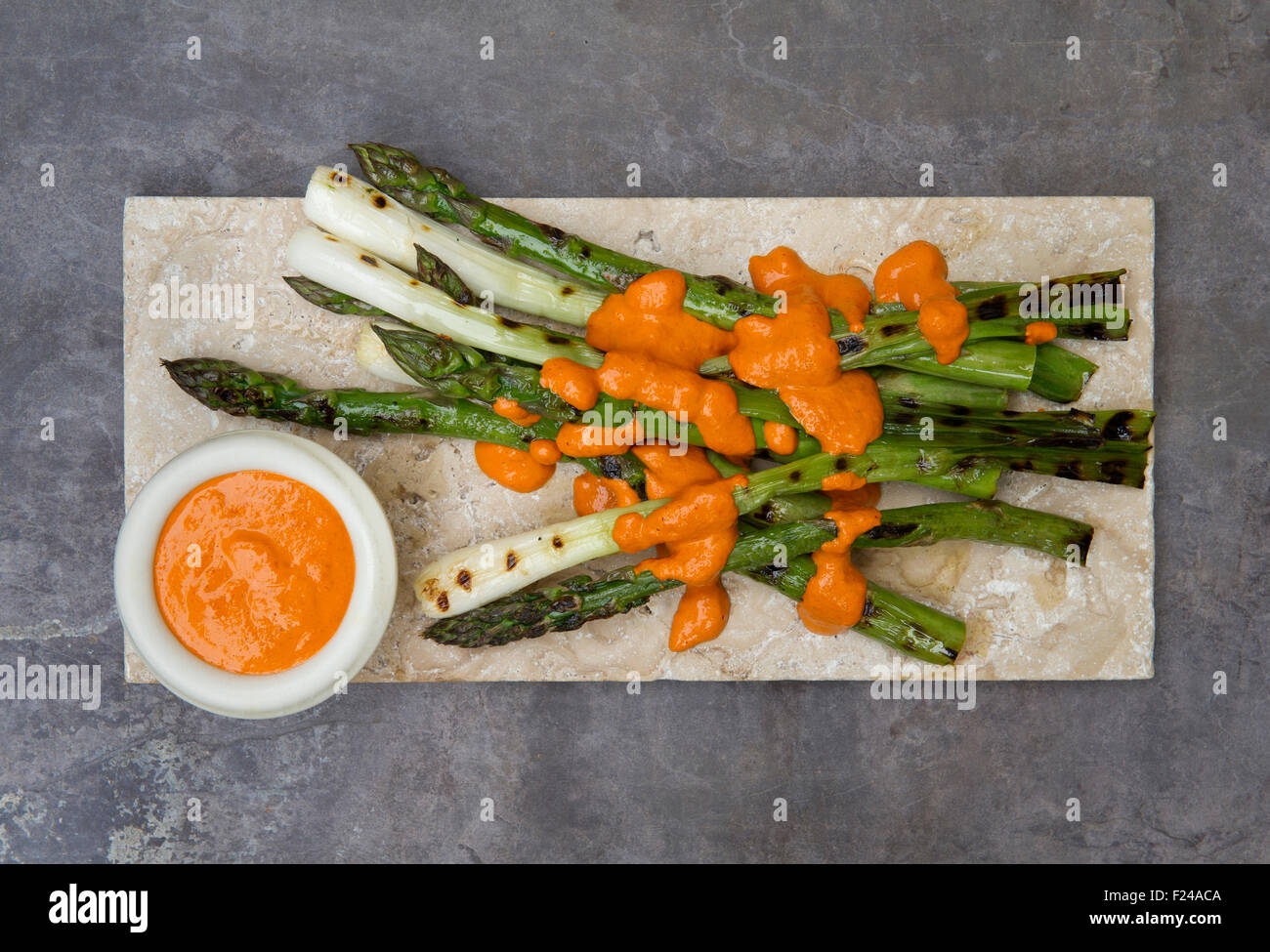 Paleo foods, asparagus, spring onion & raw romesco sauce Stock Photo