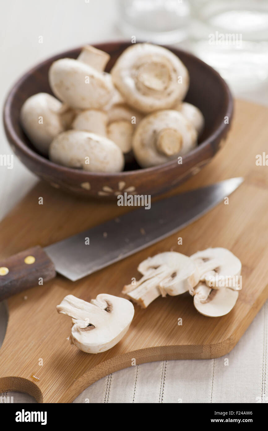 Mushrooms on chopping board Stock Photo