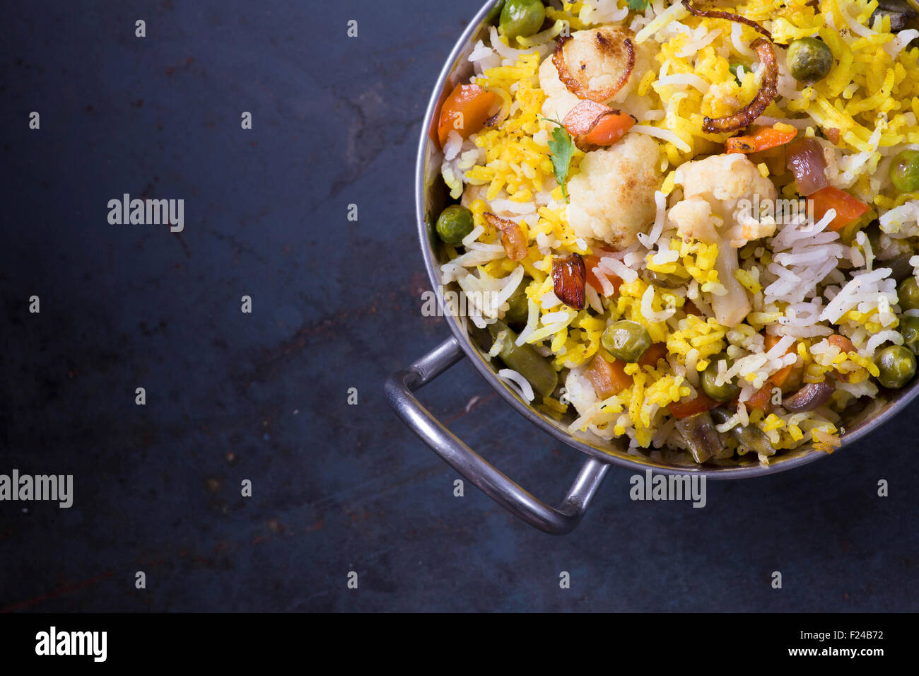 Vegetarian Biryani on dark metal background with copy space Stock Photo