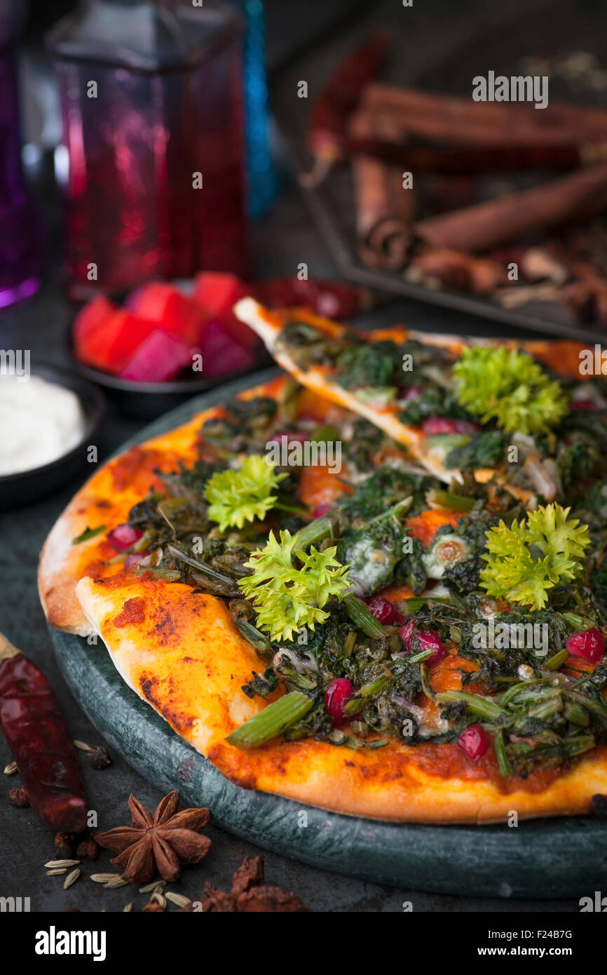 An Arabian manakish bread snack with herbs and spinach. Arab version of pizza Stock Photo