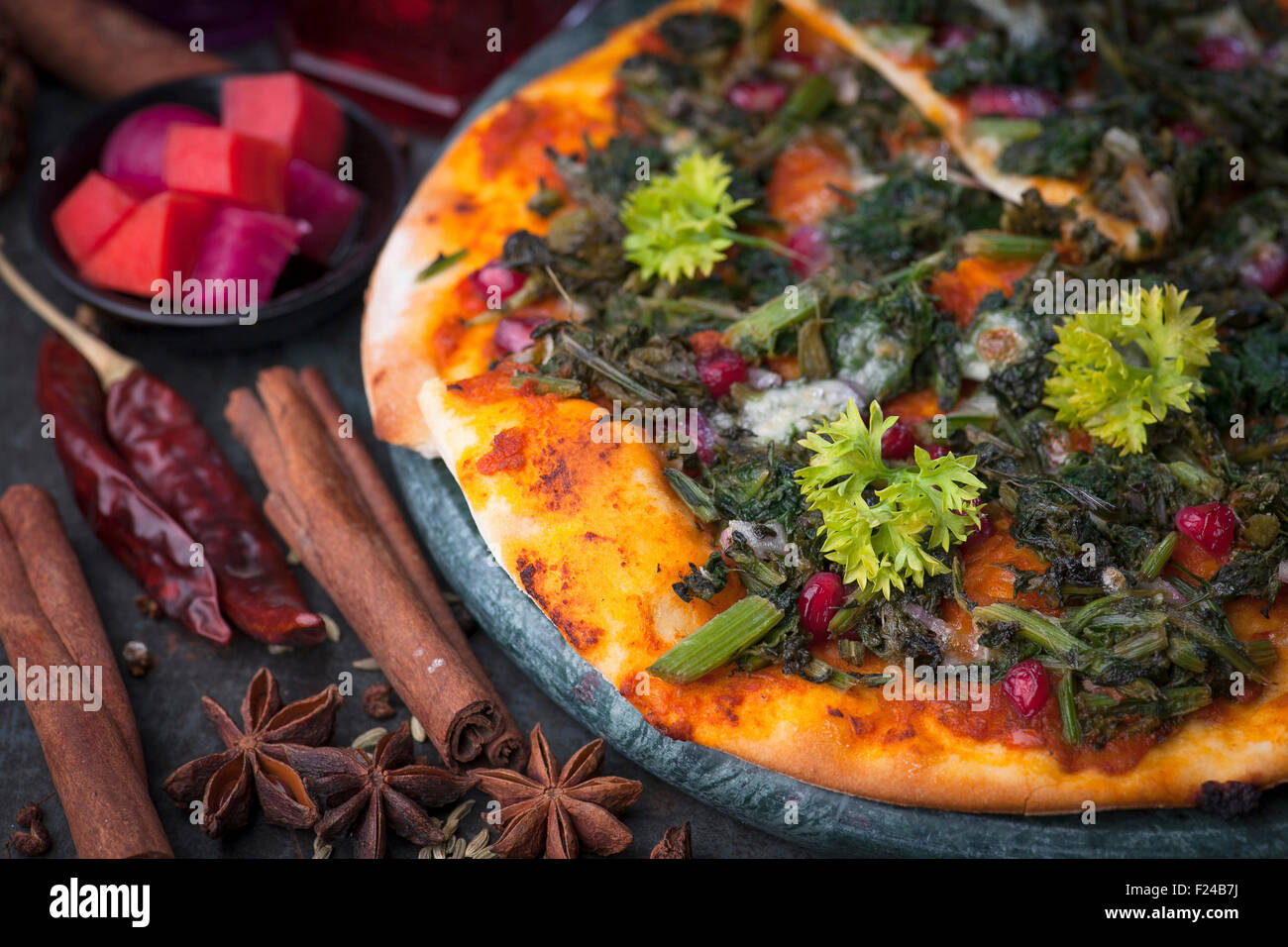 An Arabian manakish bread snack with herbs and spinach. Arab version of pizza Stock Photo