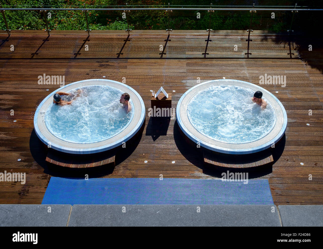 jacuzzi outdoor bathing bathers circular hot tub Stock Photo