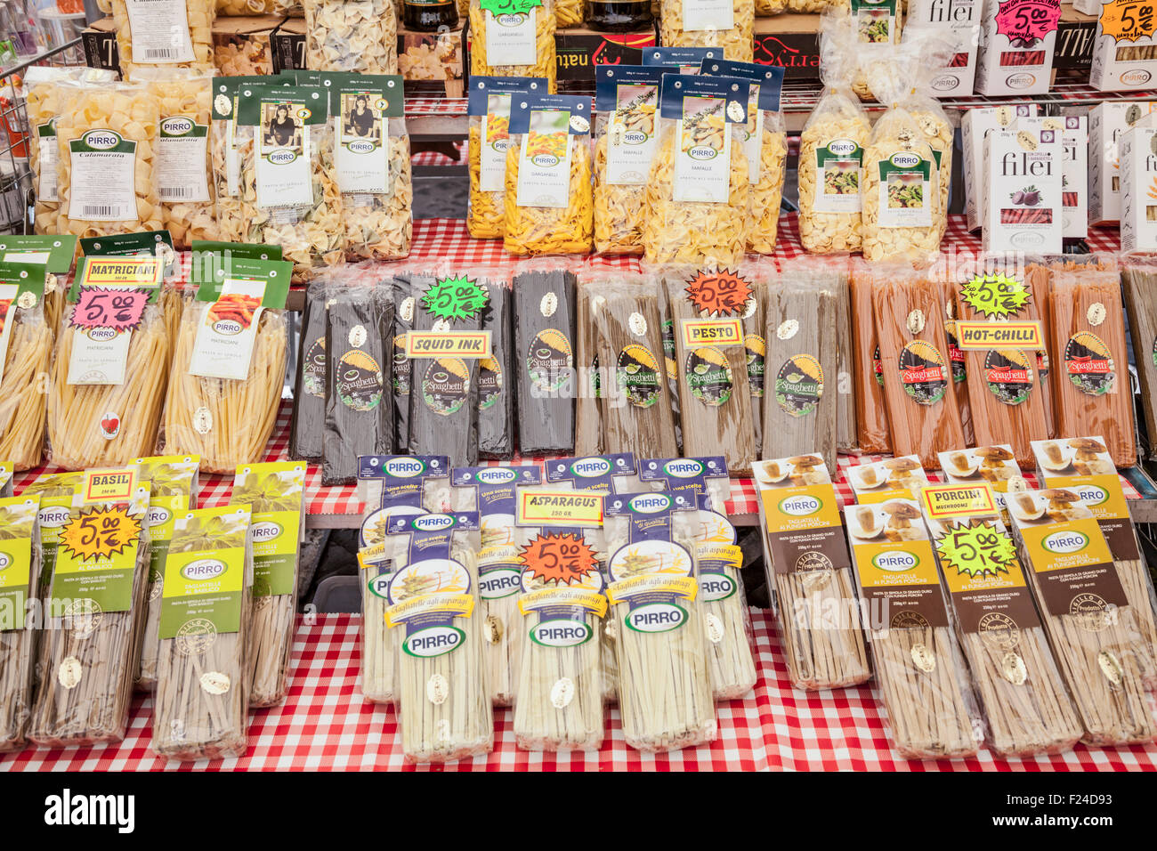 Different types of pasta for sale on a market stall in the Piazza campo