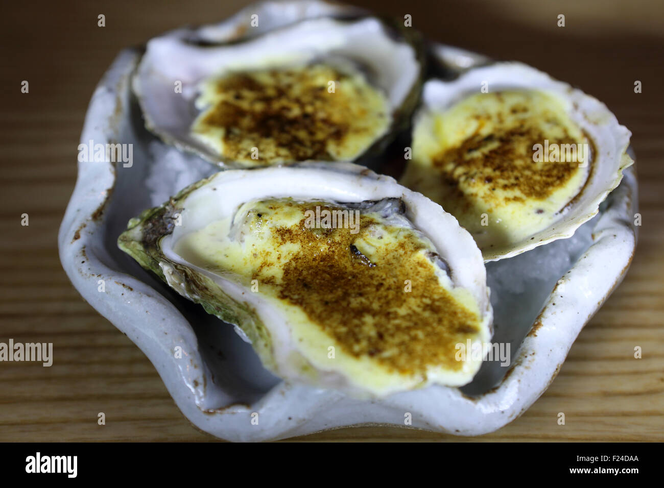 Grilled oysters with Hollandaise sauce served in Lunenburg, Nova Scotia, Canada Stock Photo Alamy