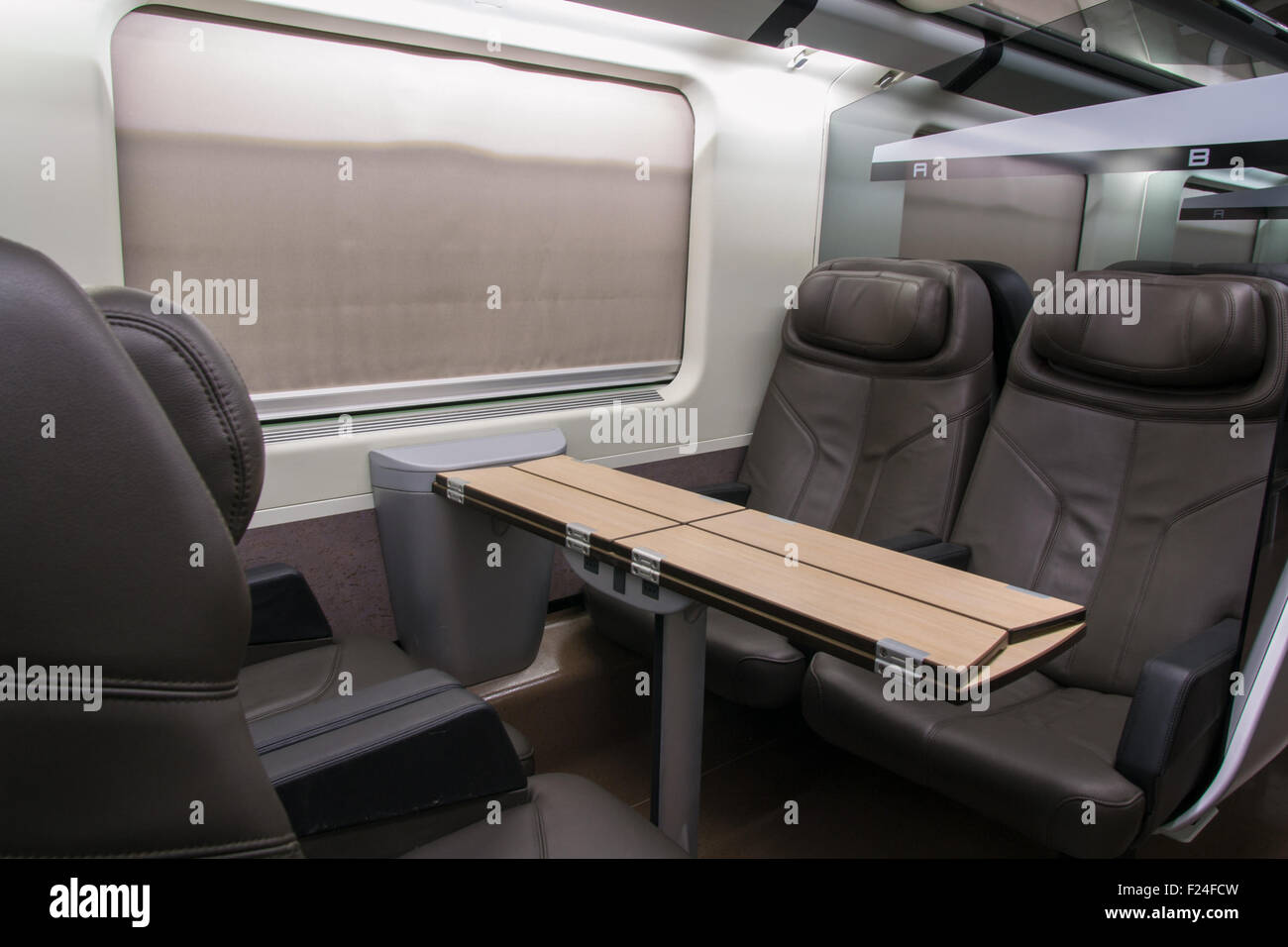 business class with leather seats of a railroad car Stock Photo