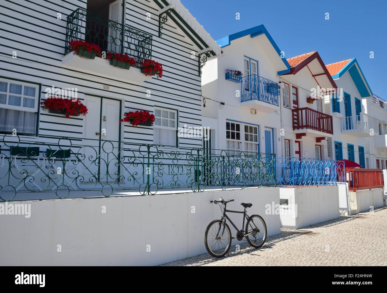 White Beach House With Colorful Details In Costa Nova Stock