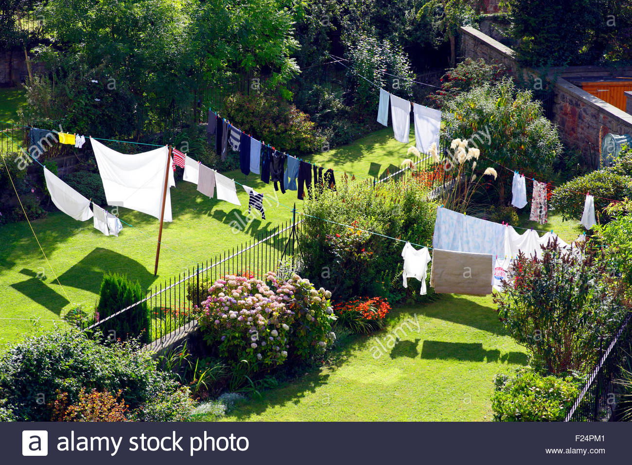 Washing line clothes drying in suburban back gardens Stock Photo - Alamy