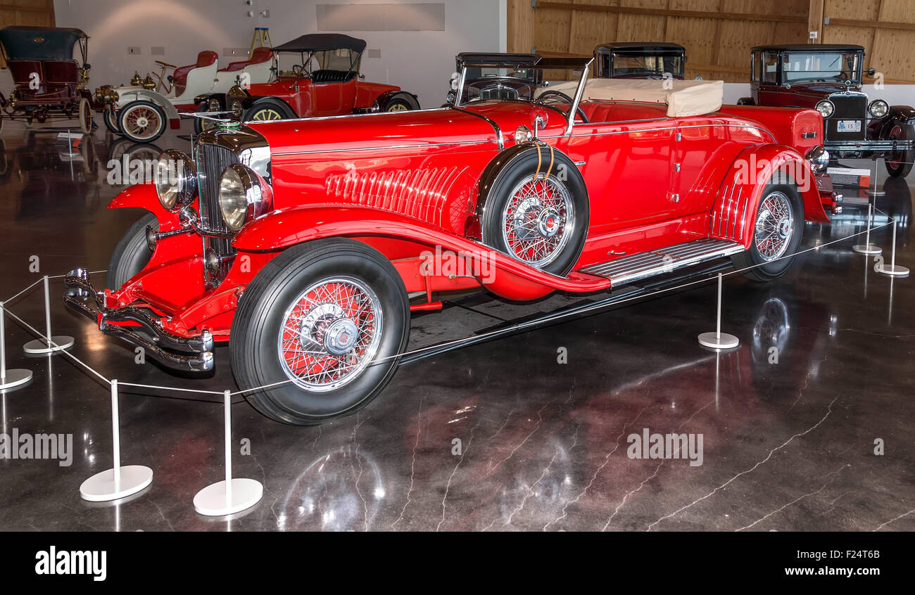 Red 1930 Duesenberg on display at the American Car Museum,