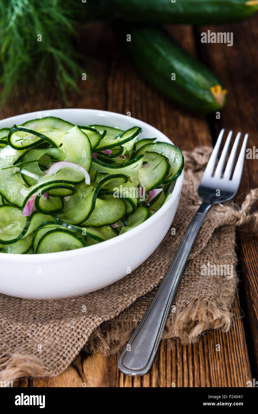 Portion of fresh made Cucumber Salad with onions and dill Stock Photo
