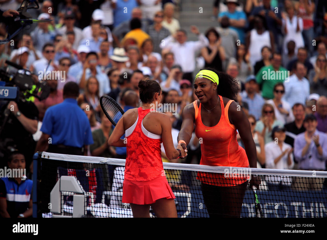 Flushings Meadow, New York, USA. 11th Sep, 2015. Roberta Vinci of Italy shakes hands with Serena Williams after defeating Williams in their semifinal match at the U.S. Open in Flushing Meadows, New York on the afternoon of September 11th, 2015. Vinci won the match 2-6, 6-4, 6-4. Credit:  Adam Stoltman/Alamy Live News Stock Photo