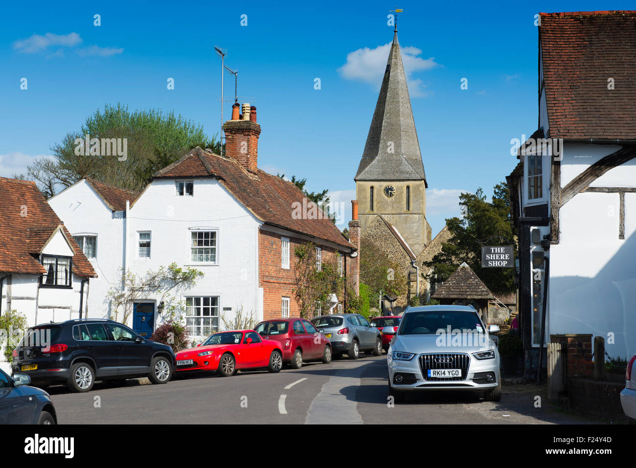 Traffic clogs the narrow roads through Shere village on a Bank Holiday in spring Stock Photo