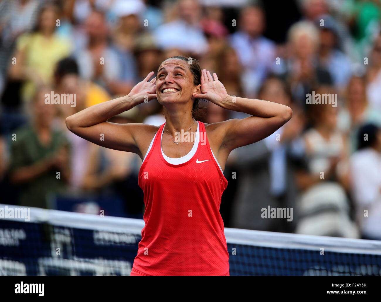 Flushings Meadow, New York, USA. 11th Sep, 2015. Roberta Vinci of Italy listens to the roar of the crowd after defeating Serena Williams in their semifinal match at the U.S. Open in Flushing Meadows, New York on the afternoon of September 11th, 2015. Vinci won the match 2-6, 6-4, 6-4. Credit:  Adam Stoltman/Alamy Live News Stock Photo