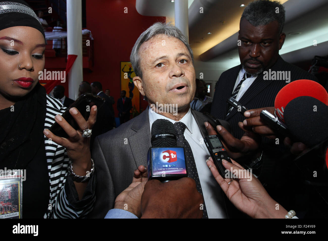 Port of Spain, Trinidad. 11th Sept, 2015. Colm Imbert (C), Minister of Finance, speaks to journalists after the swearing-in ceremony for Ministers of Government at Queen's Hall in Port of Spain, Trinidad on September 11, 2015. Credit:  SEAN DRAKES/Alamy Live News Stock Photo