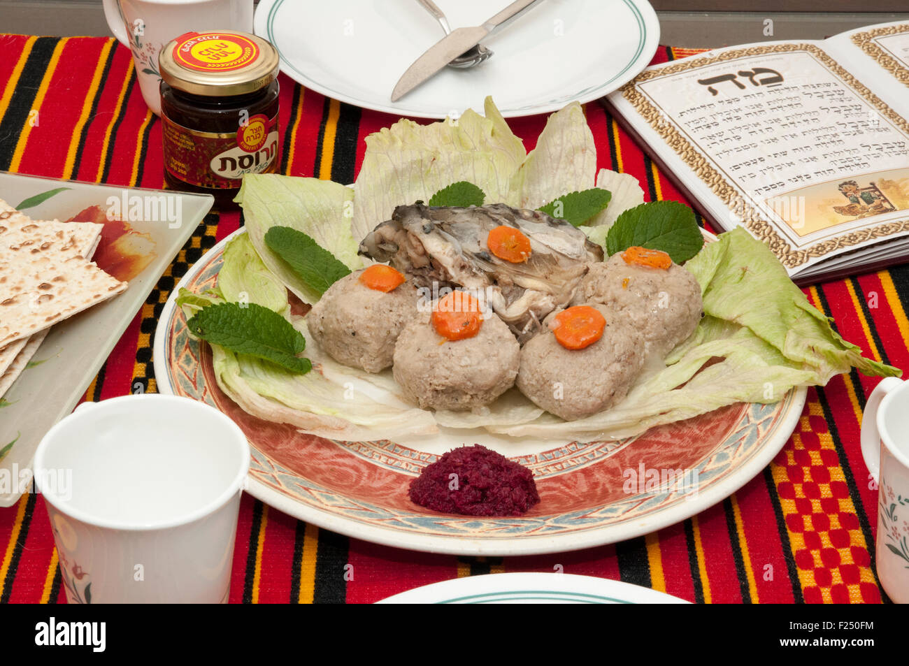 Gefilte fish with carrot. A traditional Askenazi Jewish festive dish of poached fish patties made from a mixture of ground debon Stock Photo