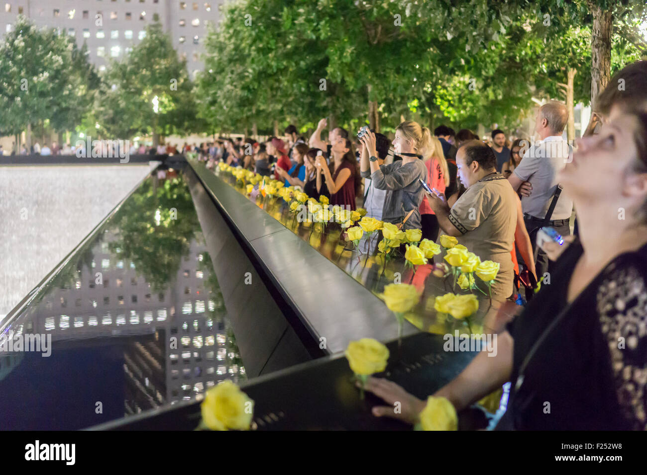 New York, New York, USA. 11th Sep, 2015. People gather at the 9/11 Memorial in New York on September 11, 2015 for the 14th anniversary of the September 11, 2001 terrorist attacks. Credit:  Richard Levine/Alamy Live News Stock Photo