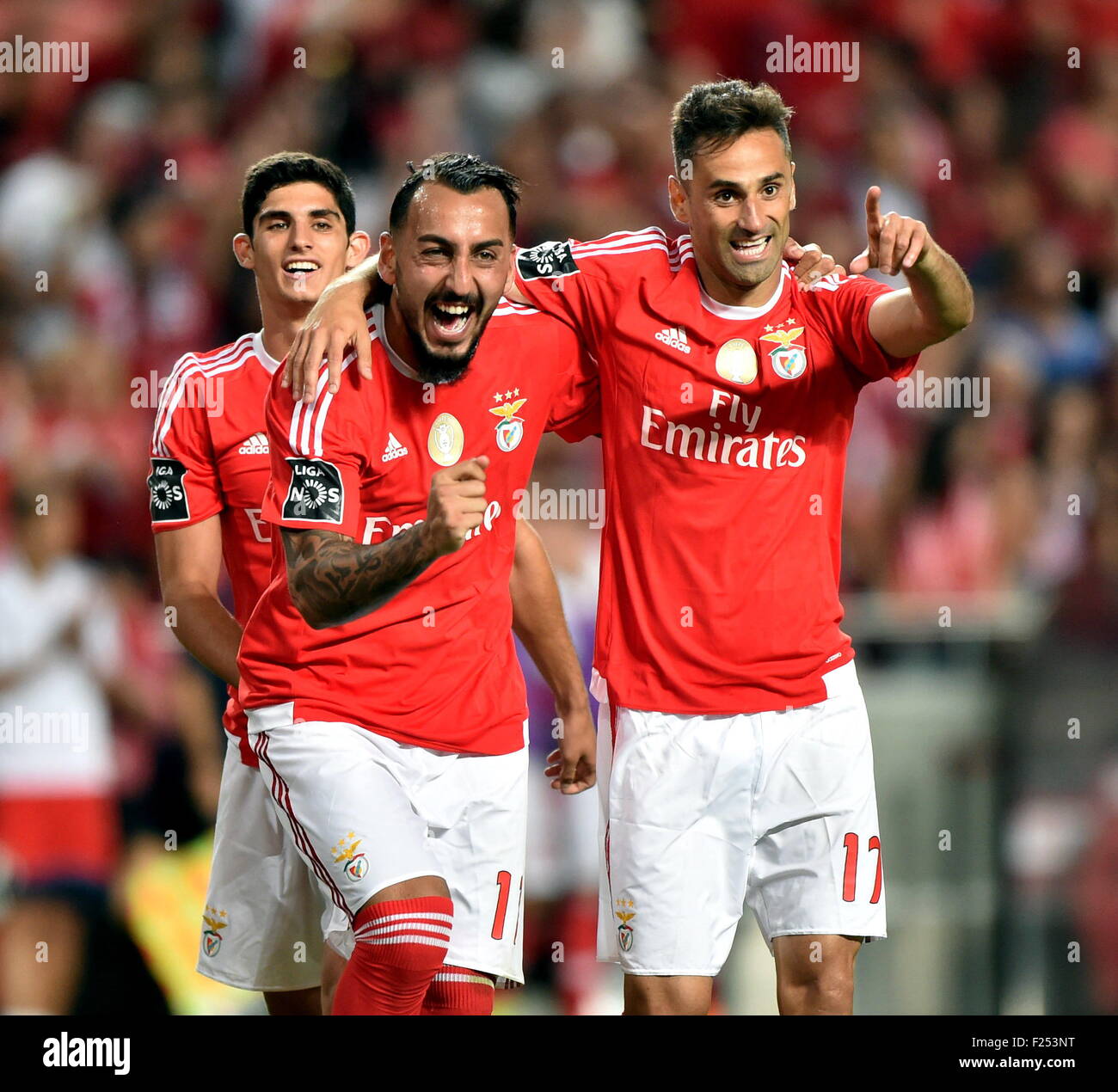 Lisbon, Portugal. 11th Sep, 2015. Kostas Mitroglou (C) of Benfica celebrates with his teammate Jonas Goncalves after scoring during their Portuguese Premier League soccer match against Belenenses in Lisbon, Portugal, Sept. 11, 2015. Benfica won 6-0. Credit:  Zhang Liyun/Xinhua/Alamy Live News Stock Photo