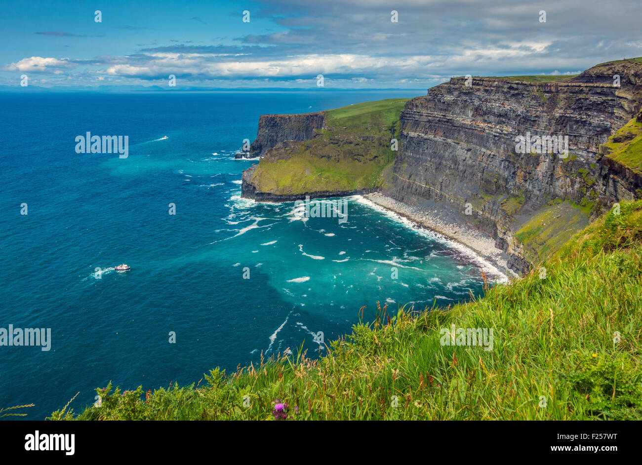 Cliffs of Moher with tourist boat, Co Galway, Ireland Stock Photo